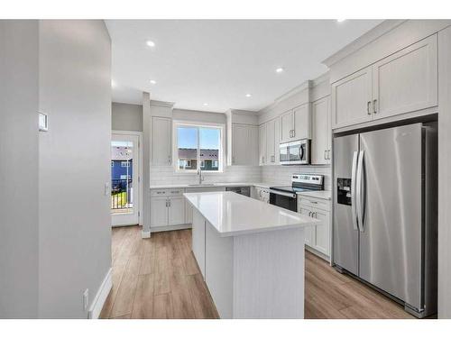 143 Amblefield Avenue Nw, Calgary, AB - Indoor Photo Showing Kitchen With Upgraded Kitchen