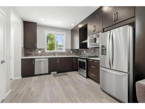 101-110 Redstone Ne, Calgary, AB - Indoor Photo Showing Kitchen With Upgraded Kitchen