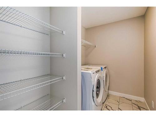 251 Belvedere Drive Se, Calgary, AB - Indoor Photo Showing Laundry Room
