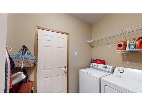 157 Chapalina Close Se, Calgary, AB - Indoor Photo Showing Laundry Room