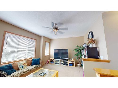 157 Chapalina Close Se, Calgary, AB - Indoor Photo Showing Living Room