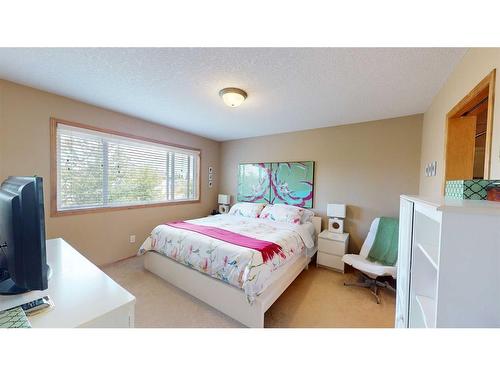 157 Chapalina Close Se, Calgary, AB - Indoor Photo Showing Bedroom