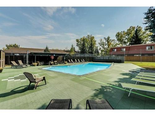 23-714 Willow Park Drive Se, Calgary, AB - Outdoor With In Ground Pool With Backyard