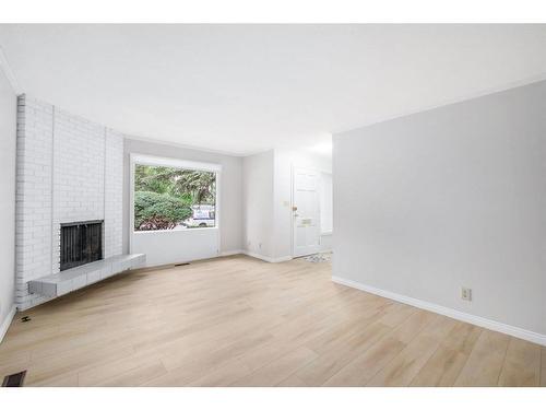 23-714 Willow Park Drive Se, Calgary, AB - Indoor Photo Showing Living Room With Fireplace