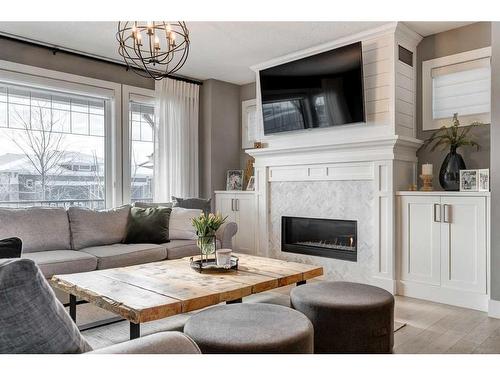 34 Yarrow Gate, Rural Rocky View County, AB - Indoor Photo Showing Living Room With Fireplace