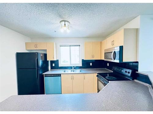 1101-10 Prestwick Bay Se, Calgary, AB - Indoor Photo Showing Kitchen