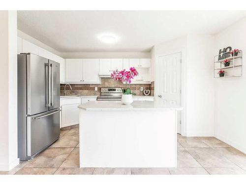 79 Bridlewood Avenue Sw, Calgary, AB - Indoor Photo Showing Kitchen