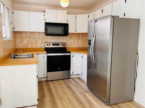 352 Falshire Way Ne, Calgary, AB - Indoor Photo Showing Kitchen With Stainless Steel Kitchen With Double Sink