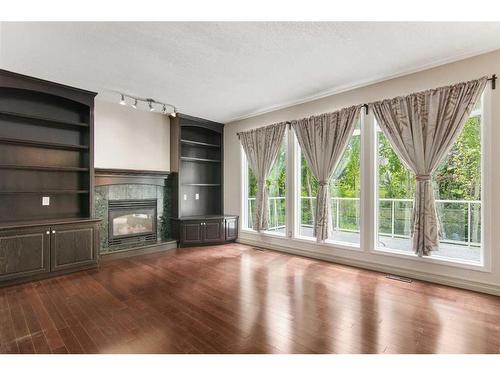 123 Hamptons Square Nw, Calgary, AB - Indoor Photo Showing Living Room With Fireplace
