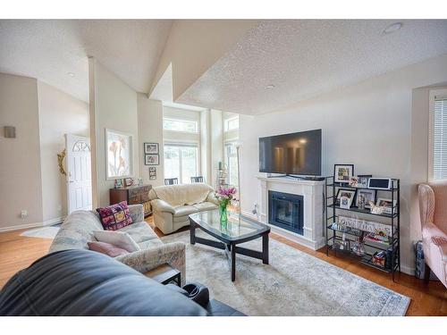171 Sierra Morena Terrace Sw, Calgary, AB - Indoor Photo Showing Living Room With Fireplace