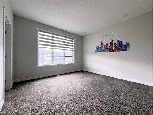 32 Carringvue Link Nw, Calgary, AB - Indoor Photo Showing Other Room