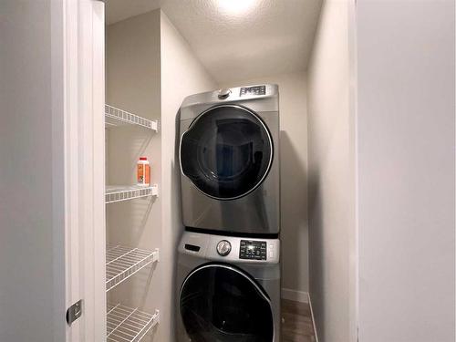 32 Carringvue Link Nw, Calgary, AB - Indoor Photo Showing Laundry Room
