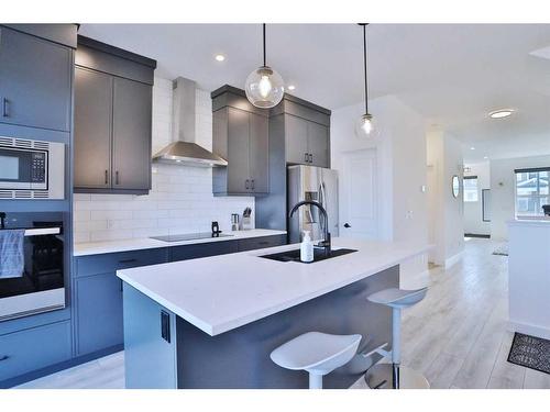 151 Rowley Gate Nw, Calgary, AB - Indoor Photo Showing Kitchen With Upgraded Kitchen