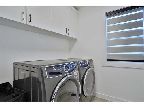 151 Rowley Gate Nw, Calgary, AB - Indoor Photo Showing Laundry Room