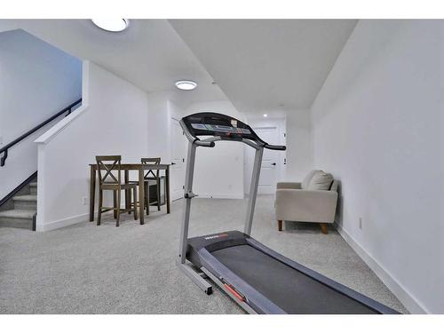 151 Rowley Gate Nw, Calgary, AB - Indoor Photo Showing Gym Room