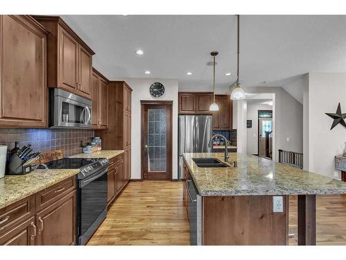 22 Cranarch Link Se, Calgary, AB - Indoor Photo Showing Kitchen With Double Sink With Upgraded Kitchen