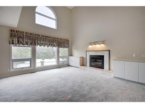 117 Candle Place Sw, Calgary, AB - Indoor With Fireplace