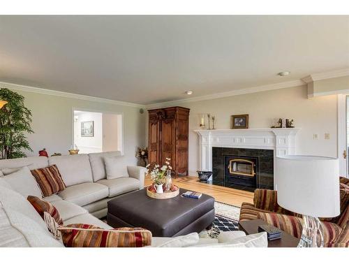 100A-17177 306 Avenue East, Rural Foothills County, AB - Indoor Photo Showing Living Room With Fireplace