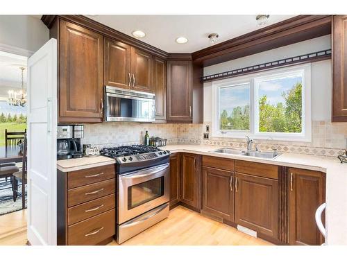 100A-17177 306 Avenue East, Rural Foothills County, AB - Indoor Photo Showing Kitchen With Double Sink