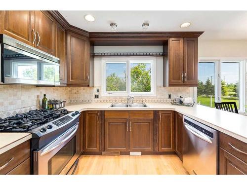 100A-17177 306 Avenue East, Rural Foothills County, AB - Indoor Photo Showing Kitchen With Stainless Steel Kitchen With Double Sink