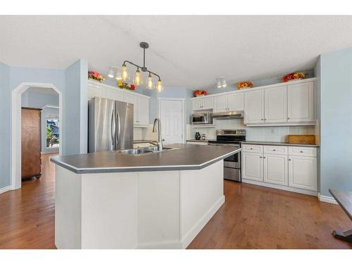 101 Bridlecreek Park Sw, Calgary, AB - Indoor Photo Showing Kitchen With Double Sink