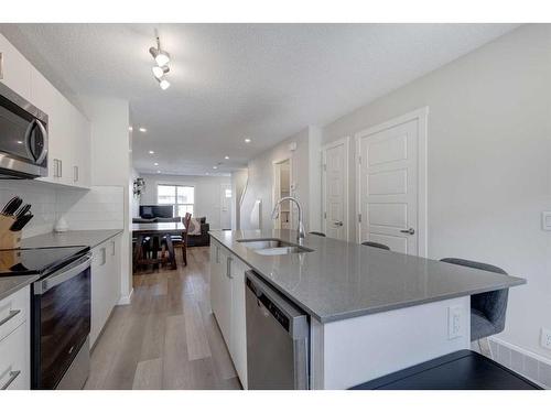 411 Cranbrook Square Se, Calgary, AB - Indoor Photo Showing Kitchen With Upgraded Kitchen