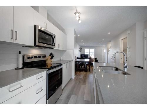 411 Cranbrook Square Se, Calgary, AB - Indoor Photo Showing Kitchen With Double Sink With Upgraded Kitchen