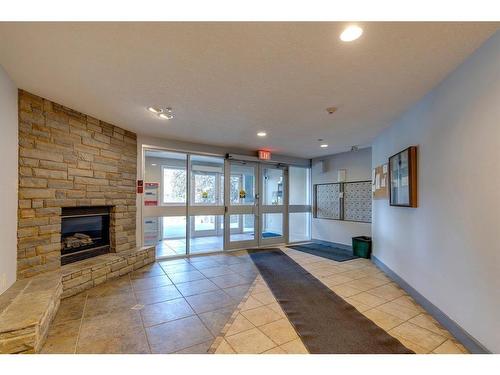 108-790 Kingsmere Crescent Sw, Calgary, AB - Indoor With Fireplace
