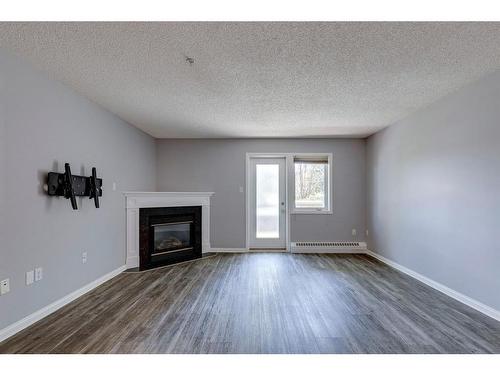 108-790 Kingsmere Crescent Sw, Calgary, AB - Indoor Photo Showing Living Room With Fireplace
