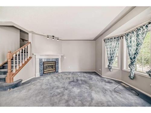 105 Mt Mckenzie Gardens Se, Calgary, AB - Indoor With Fireplace