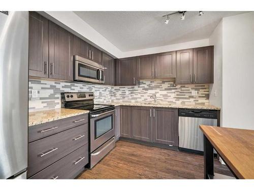 1307-99 Copperstone Park Se, Calgary, AB - Indoor Photo Showing Kitchen With Stainless Steel Kitchen With Upgraded Kitchen