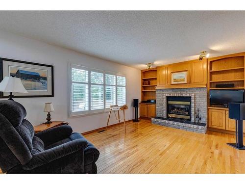 1306 Shannon Avenue Sw, Calgary, AB - Indoor Photo Showing Living Room With Fireplace