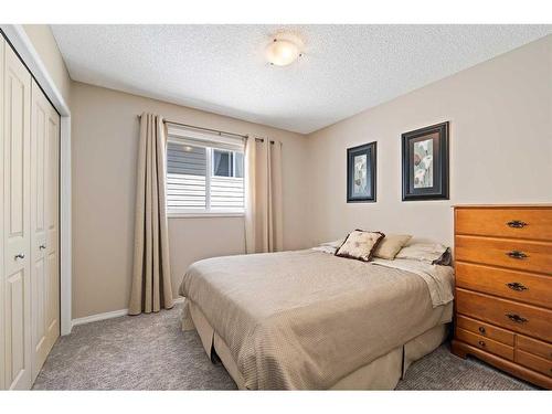 100 Tuscany Ridge Crescent Nw, Calgary, AB - Indoor Photo Showing Bedroom