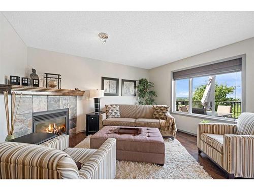 100 Tuscany Ridge Crescent Nw, Calgary, AB - Indoor Photo Showing Living Room With Fireplace
