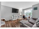 18 Deerfield Green Se, Calgary, AB  - Indoor Photo Showing Living Room 