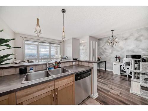 2-145 Rockyledge View Nw, Calgary, AB - Indoor Photo Showing Kitchen With Double Sink