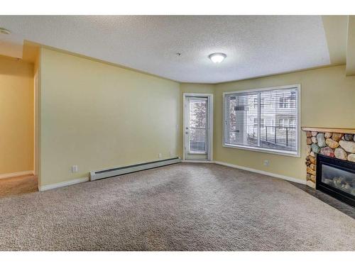 123-369 Rocky Vista Park Nw, Calgary, AB - Indoor With Fireplace