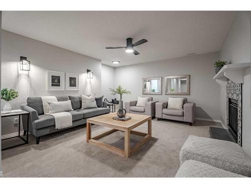 117 Rocky Ridge Landing Nw, Calgary, AB - Indoor Photo Showing Living Room