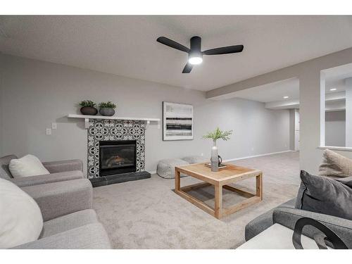 117 Rocky Ridge Landing Nw, Calgary, AB - Indoor Photo Showing Living Room With Fireplace