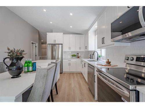 117 Rocky Ridge Landing Nw, Calgary, AB - Indoor Photo Showing Kitchen With Upgraded Kitchen