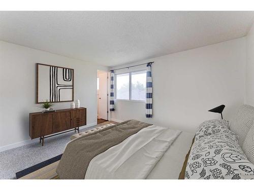 423 Brookmere Crescent Sw, Calgary, AB - Indoor Photo Showing Bedroom