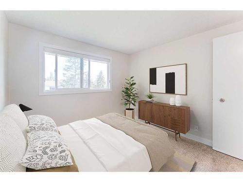 423 Brookmere Crescent Sw, Calgary, AB - Indoor Photo Showing Bedroom