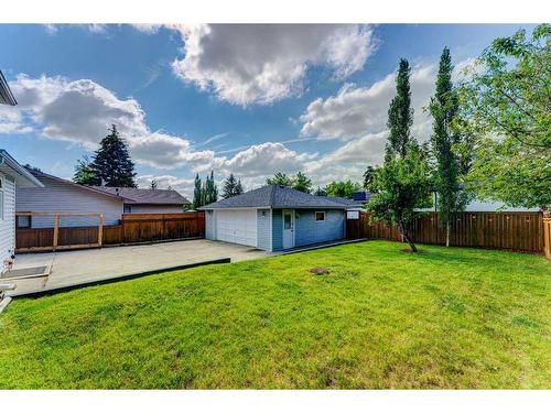 423 Brookmere Crescent Sw, Calgary, AB - Outdoor With Backyard