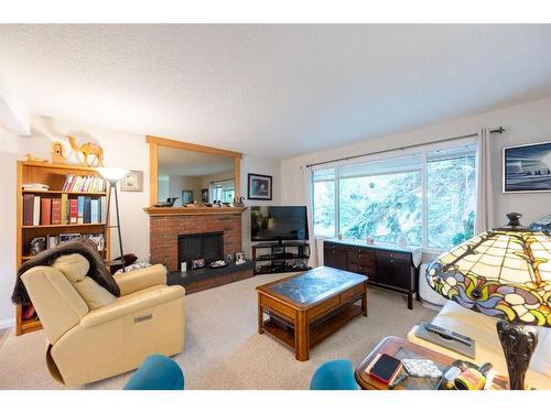 136 Silver Ridge Close Nw, Calgary, AB - Indoor Photo Showing Living Room With Fireplace