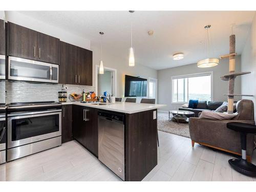 202-24 Sage Hill Terrace Nw, Calgary, AB - Indoor Photo Showing Kitchen With Double Sink With Upgraded Kitchen