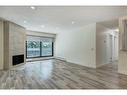 537-10120 Brookpark Boulevard Sw, Calgary, AB  - Indoor Photo Showing Other Room With Fireplace 