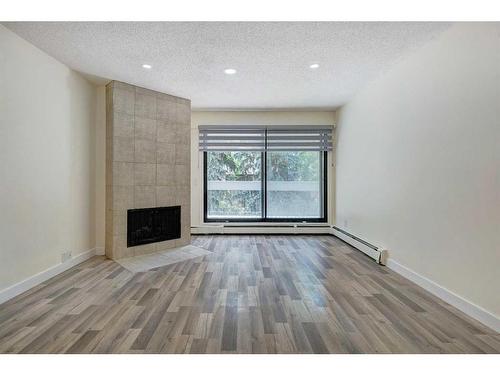 537-10120 Brookpark Boulevard Sw, Calgary, AB - Indoor With Fireplace