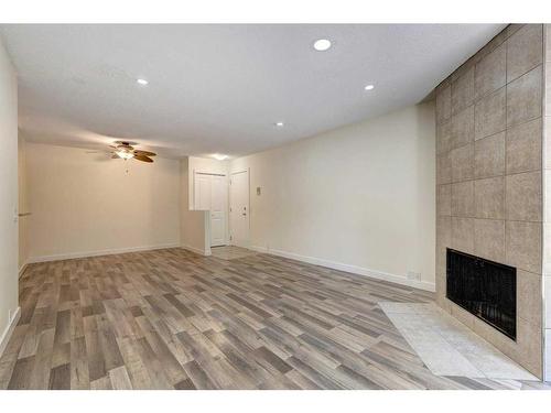 537-10120 Brookpark Boulevard Sw, Calgary, AB - Indoor Photo Showing Other Room With Fireplace