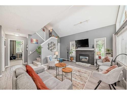 31-5616 14 Avenue Sw, Calgary, AB - Indoor Photo Showing Living Room With Fireplace