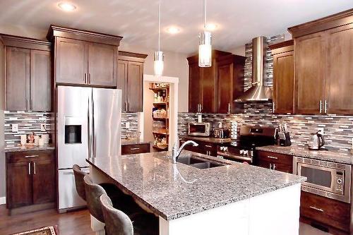 121 Lalor Drive Se, Red Deer, AB - Indoor Photo Showing Kitchen With Double Sink With Upgraded Kitchen